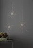 Three starburst-shaped LED lights hang against a gray background, with a bowl of decorative items in the foreground. Produktbild-Vorschau