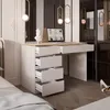 A white desk with open drawers, a laptop, and a sculpture in a bedroom setting. Produktbild-Vorschau