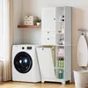 A laundry room scene with a washing machine and a storage cabinet. Náhled obrázku produktu