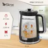 A black electric kettle with a cutaway view showing water heating, placed on a wooden surface with product specifications and branding. Podgląd zdjęcia produktu