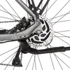 A close-up view of the rear wheel and drivetrain of a bicycle, focusing on the disc brake and derailleur. Produktbild-Vorschau