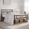A black metal bed frame with a patterned headboard is shown in a bedroom setting. Produktbild-Vorschau
