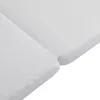 A close-up view of two white folded mattress sections. Produktbild-Vorschau