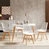 A dining room setting with a table and chairs. Náhled obrázku produktu