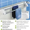 A towel rack attached to a radiator, with two towels hanging on it. Produktbild-Vorschau