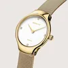 A close-up studio shot of a gold-colored women's watch with a white face and diamond markers. Produktbild-Vorschau