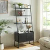 A black ladder shelf with a cabinet is filled with decorative items and books, placed in a well-lit room next to a window. Anteprima dell’immagine prodotto