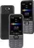 Three black swisstone mobile phones are displayed against a white background. One phone is shown from the back, and two are shown from the front. Náhľad obrázku produktu