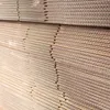 A close-up, stacked view of corrugated cardboard boxes. Anteprima dell’immagine prodotto