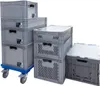 Several stacked grey plastic storage boxes of various sizes, with one set on a blue wheeled dolly. Produktbild-Vorschau