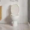 A white toilet with an open apricot-colored lid and seat, set against a tiled wall and floor. Voir les images du produit