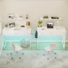 Two white desks with chairs and accessories in a room. Produktbild-Vorschau