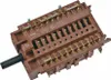A close-up, angled view of a brown electrical switch with gold-colored connectors and a black knob. Produktbild-Vorschau