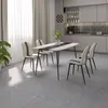 A dining room with a table and chairs set up in front of a kitchen counter. Produktbild-Vorschau