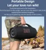 A person is holding a large portable speaker outdoors. Produktbild-Vorschau