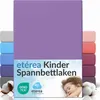 A product image showing a stack of colorful fitted sheets with a child sleeping on a pillow in the foreground. Podgląd zdjęcia produktu