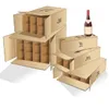 Several cardboard boxes for wine bottles are stacked, with one bottle of wine on top of a box. Produktbild-Vorschau