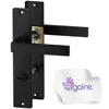 A black door handle set with a gold lock mechanism, presented on a white background with a cleaning cloth featuring a logo. Produktbild-Vorschau