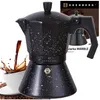 A speckled black moka pot with coffee pouring into a white cup. Náhľad obrázku produktu