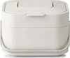 A white trash bin with a lid. Voir les images du produit