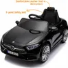 A black electric toy car, a Mercedes CLS350 replica, shown from a front-diagonal angle. Produktbild-Vorschau