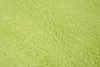 A close-up, textured view of a green shag carpet. Voir les images du produit