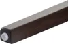 Close-up of the bottom of a dark wooden chair leg with a white protective cap. Náhľad obrázku produktu