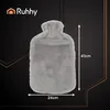 A grey plush hot water bottle is shown against a dark background with decorative lines. Dimensions are indicated. Náhled obrázku produktu