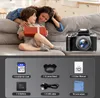 A mother and child on a couch, with a camera and accessories displayed below. Produktbild-Vorschau