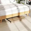A wooden folding desk is shown partially extended from under a bed frame. Anteprima dell’immagine prodotto