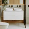 A modern bathroom with a double vanity, sinks, and a toilet. Náhled obrázku produktu