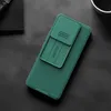 A dark, textured surface with a green phone case placed diagonally. Produktbild-Vorschau