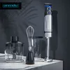 A hand blender set with accessories on a marble countertop against a dark background with shadows. Anteprima dell’immagine prodotto