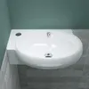 A white ceramic sink is shown installed in a bathroom setting, with teal walls and gray tiled flooring. Produktbild-Vorschau