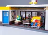 A detailed Lego model of a Shell gas station with a convenience store and car wash. Podgląd zdjęcia produktu