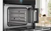 Close-up view of the interior of a modern oven with the water reservoir visible. Anteprima dell’immagine prodotto