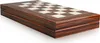 A close-up, angled view of a closed wooden backgammon board with a checkered surface visible. Podgląd zdjęcia produktu