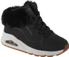 A black Skechers sneaker with a white sole and brown outsole, featuring a black fur trim around the ankle. Voir les images du produit
