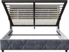 A view of the underside of a bed frame, showing the hydraulic lift mechanism and the wooden slats. Voir les images du produit