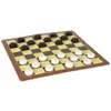 A checkers board game with black and white pieces set up on the board. Podgląd zdjęcia produktu