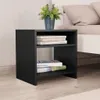 A black nightstand with books and a plant, placed next to a bed. Náhled obrázku produktu