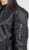 Close-up of a person wearing a black bomber jacket. Produktbild-Vorschau