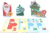 A collection of Christmas-themed advent calendar pieces and cut-out sheets. Anteprima dell’immagine prodotto