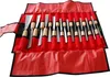 A set of carving tools laid out in a red roll-up case. Produktbild-Vorschau