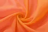 A close-up swirl of orange sheer fabric, likely a curtain or drapery. Produktbild-Vorschau