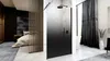 A modern bathroom and bedroom interior with a shower enclosure, bed, and curtains. Anteprima dell’immagine prodotto
