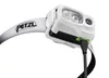 A close-up view of a white Petzl headlamp with a black charging cable plugged into its green charging port. Anteprima dell’immagine prodotto