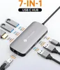A silver USB C hub with various ports and cables connected, surrounded by graphics and text indicating its features. Produktbild-Vorschau