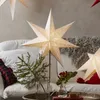 A living room scene with a couch, pillows, and decorative star lamps. Produktbild-Vorschau