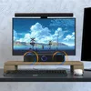 A computer setup with a monitor, soundbar, and keyboard on a desk. Voir les images du produit